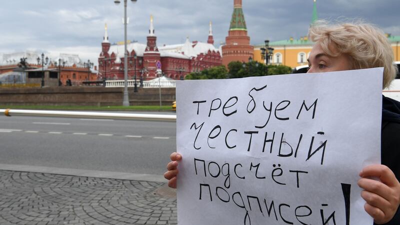 A placard reads “Demand fair signature counting” as a women protests against efforts to stop opposition candidates being registered for elections to the Moscow Duma. Photograph: Kirill Kudryavtsev/AFP