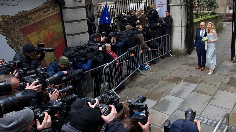 Rupert Murdoch and his new bride Jerry Hall pose for a photograph outside St Bride’s church on Fleet Street in central London. Photograph: Justin Tallis/AFP/Getty Images