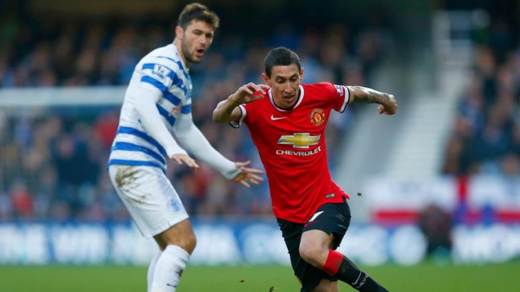 Angel Di Maria slips past QPR’S Charlie Austin during their Premier League match at Loftus Road last week, the Manchester United midfielder was played as a striker by Louis van Gaal. Photograph: Eddie Keogh/Reuters.