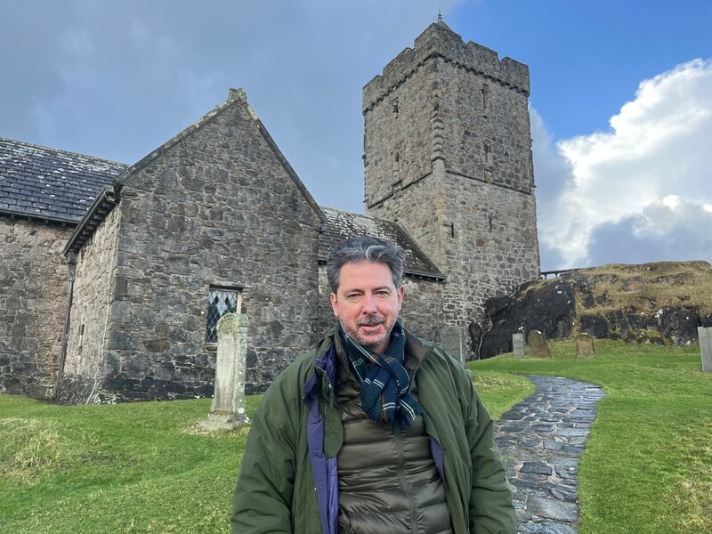 Labour candidate Torcuil Crichton outside the ancient St Clement's church in Rodel, on the Isle of Harris. Photograph: Mark Paul