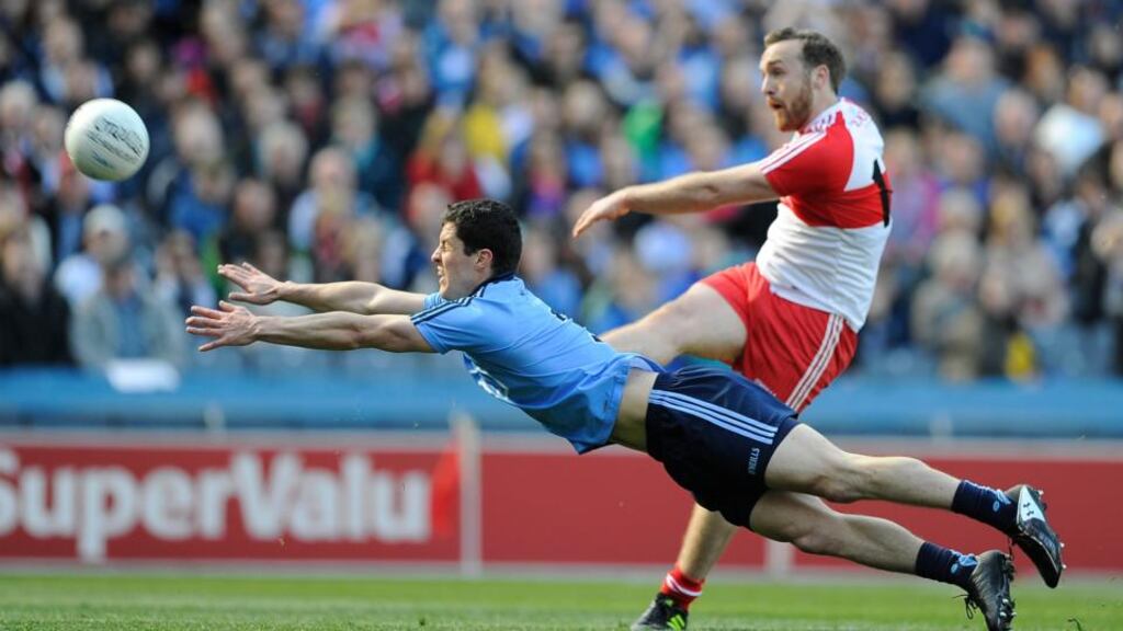 Dublin’s Rory O’Carroll fails to block a shot from Emmett McGuckin of Derry during the National Football League Division One final at Croke Park. Photograph: Tommy Grealy/Inpho.
