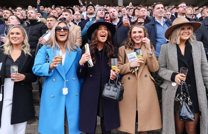 Racegoers enjoy proceedings during the Goffs Irish Ankle Novice Steeplechase at the Dublin Racing Festival, Leopardstown Racecourse, Dublin. Photograph: Tom Maher/Inpho