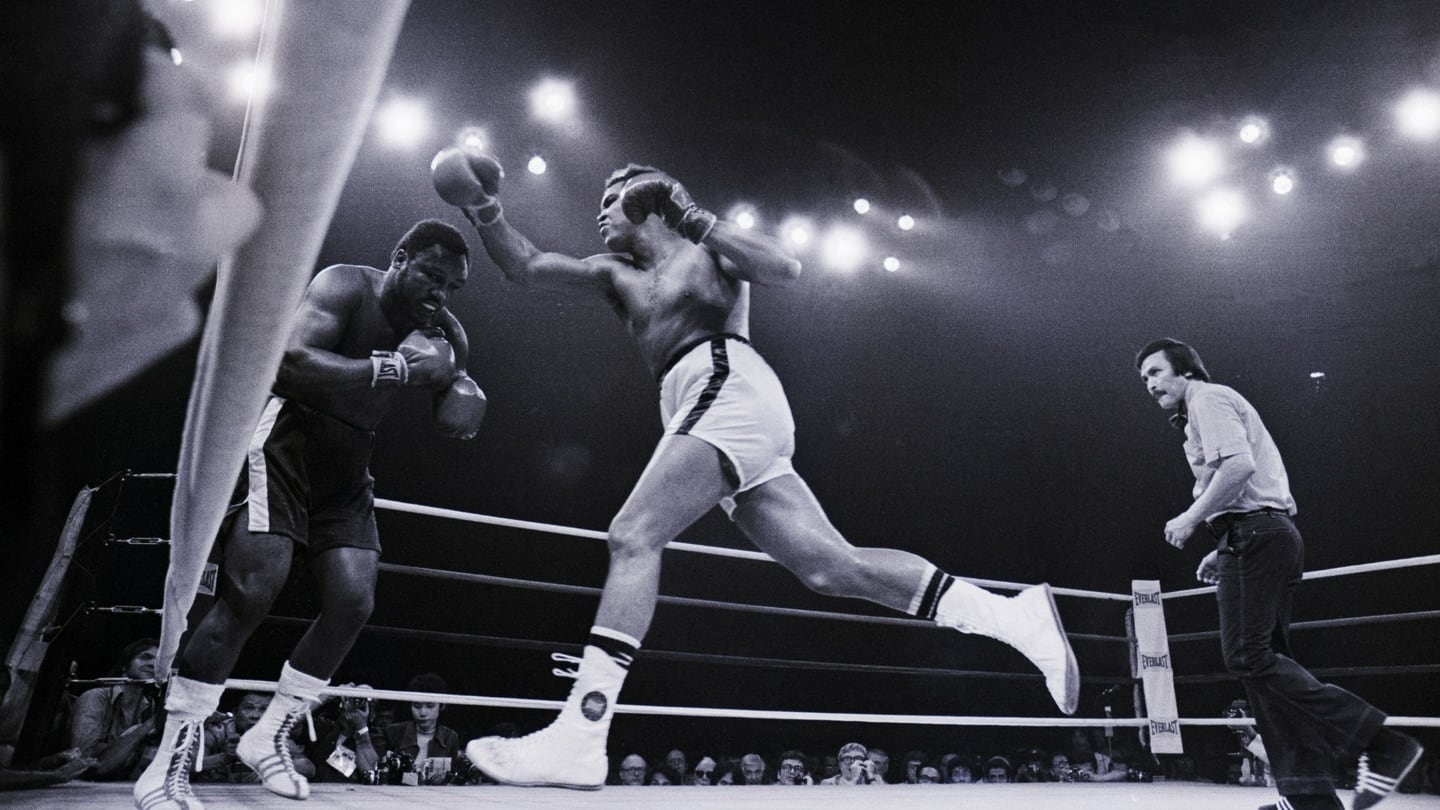 Muhammad Ali lunges at Joe Frazier during the ‘Thrilla in Manilla’ in 1975. Photo: Getty Images