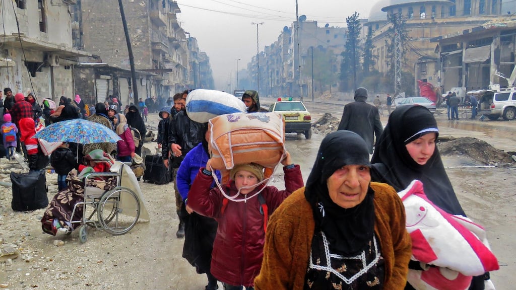 Syrian residents fleeing the conflict that has so far taken some 400,000 lives, displaced 11 million people and left much of Syria ravaged beyond all recognition. Photograph: AFP/Getty Images