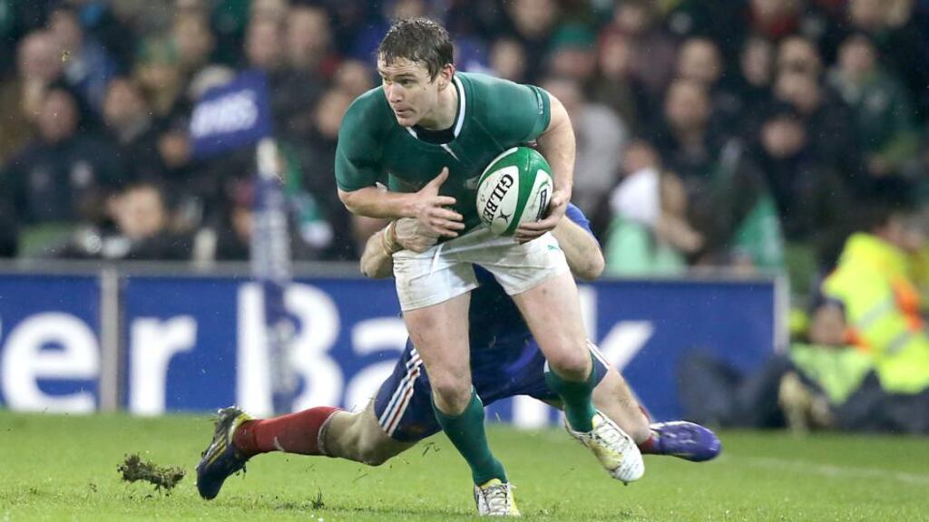 Eoin Reddan in action against France in the match in which he broke his leg.