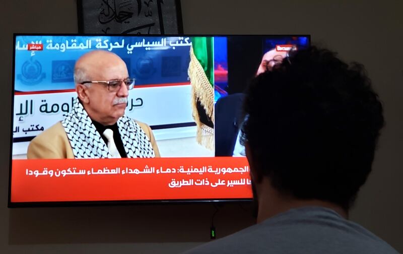 A man watches a TV showing Houthi PM Ahmed Al-Rahawi, in Sana'a, Yemen, who was killed following an Israeli air strike in the capital on Thursday, Yemen's Houthis confirmed. Photograph: EPA