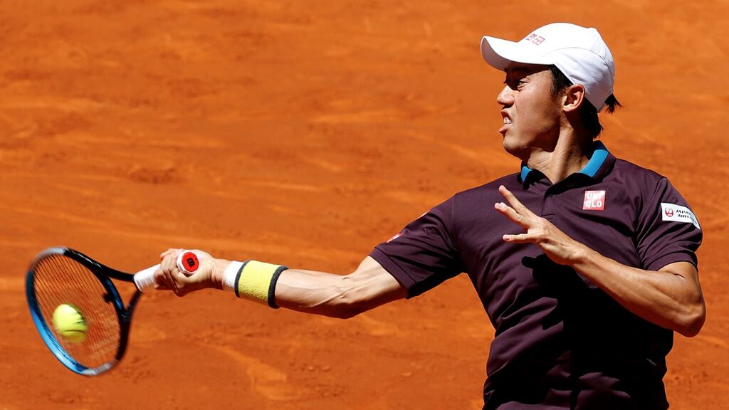 Kei Nishikori believes there are risks associated with Japan hosting the Olympic Games this summer. Photo: Chema Moya/EPA