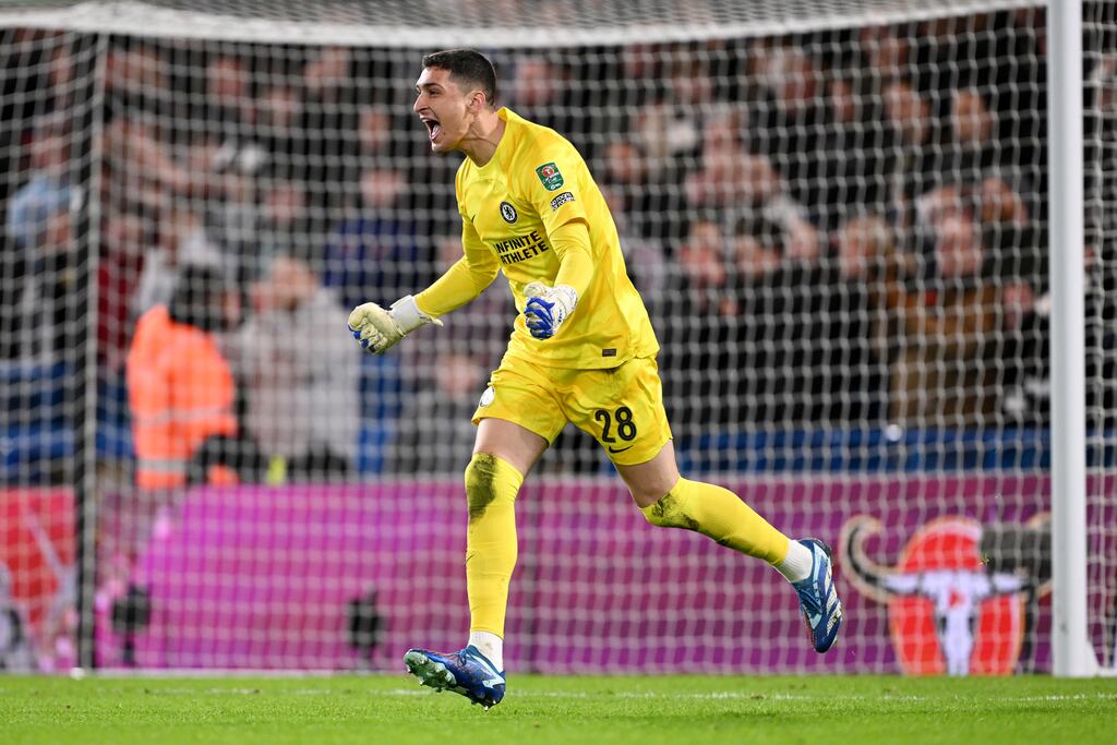 Djordje Petrovic of Chelsea saves a penalty taken by Matt Ritchie. Photograph: Mike Hewitt/Getty