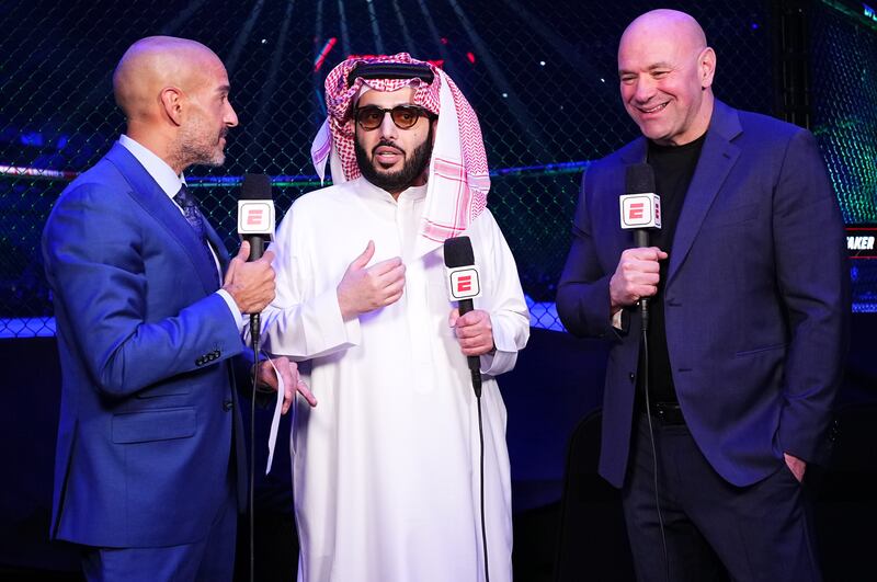 Turki Alalshikh (centre), chairman of Saudi’s General Entertainment Authority, with US mixed martial arts commentator Jon Anik (left) and Dana White, CEO of MMA promotion company UFC, at a UFC Fight Night event at Kingdom Arena in Riyadh earlier this year. Photograph: Chris Unger/Zuffa LLC/Getty