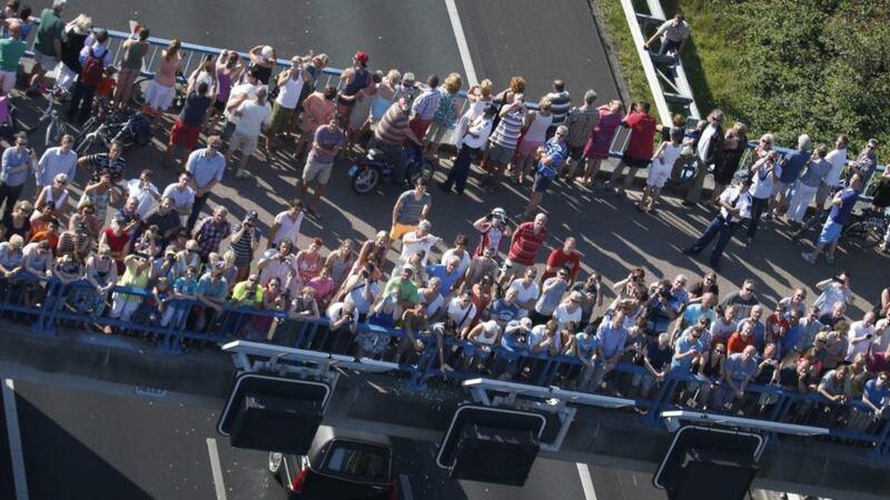 Mourners line the route as hearses carrying bodies of the victims of the MH17 plane crash leave from the airbase in Eindhoven, The Netherlands after the arrival of a Dutch Air Force C-130 Hercules plane and an Australian Royal Australian Air Force C17 transport plane with the first bodies of the 298 victims of the Malaysia Airlines MH17 plane crash in eastern Ukraine arrives from Kharkiv, Ukraine. Photograph: Jerry Lampen/EPA