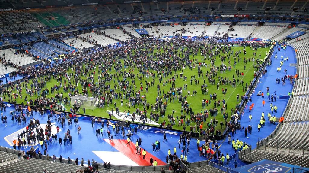 Spectators invade the pitch of the Stade de France stadium after the international friendly between France and Germany. Photo: Michel Euler/PA
