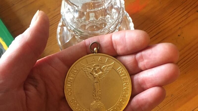 John Treacy shows the gold medal from the World Cross-Country Championships in Limerick.