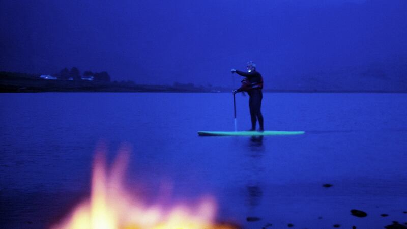 Night-time paddleboarding on Cloon Lough in Kerry’s Dark Sky Reserve. Photograph: Tadgh Hayes