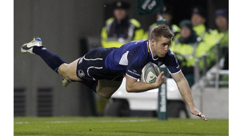 Luke Fitzgerald takes the aerial route in scoring his second and Leinster’s fourth try in the Heneken Cup clash against Bath at the Aviva Stadium. – (Photograph: Julien Behal/PA).