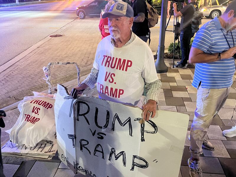 Bob Kunst, from Miami Beach, was selling ‘Trump vs Tramp’ T–shirts outside the Palm Beach County Convention Centre during Donald Trump's election watch party