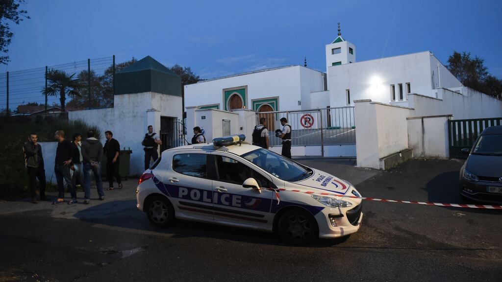 French police officers and people stand in front of the Mosque of Bayonne, southwestern France on Saturday after two people were injured in a shooting. Photograph: Gaizka Iroz/AFP via Gettys)