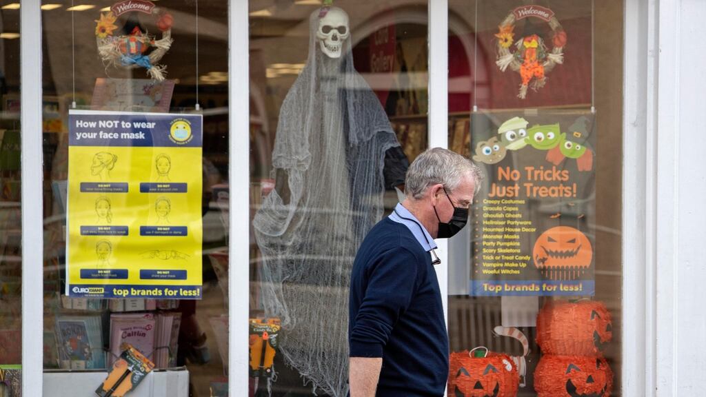 Shoppers walk past Covid signs in Celbridge, Co Kildare. Photograph: Colin Keegan/ Collins Dublin