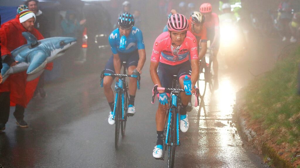 Team Movistar’s Richard Carapaz, wearing the overall leader’s pink jersey, climbs followed by team-mate Mikel Landa and Team Bahrain rider Vincenzo Nibali during stage 16 of the Giro d’Italia from Lovere to Ponte Di Legno. Photograph: Luk Benies/AFP/Getty Images