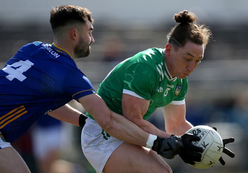Wicklow's Malachy Stone tackling Peter Nash of Limerick in their Division 4 game on March 16th, 2025. Photograph: Leah Scholes/Inpho