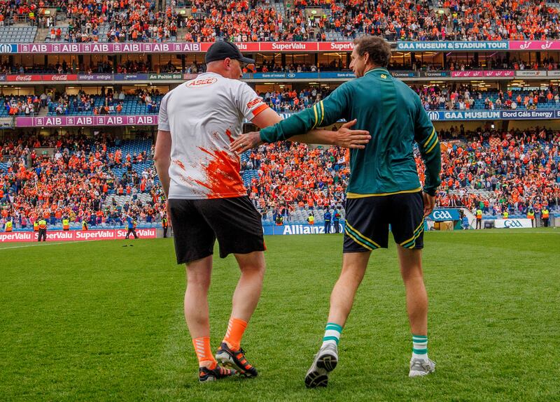 Armagh selector Kieran Donaghy and Kerry performance coach Tony Griffin after the game. Photograph: James Crombie/Inpho