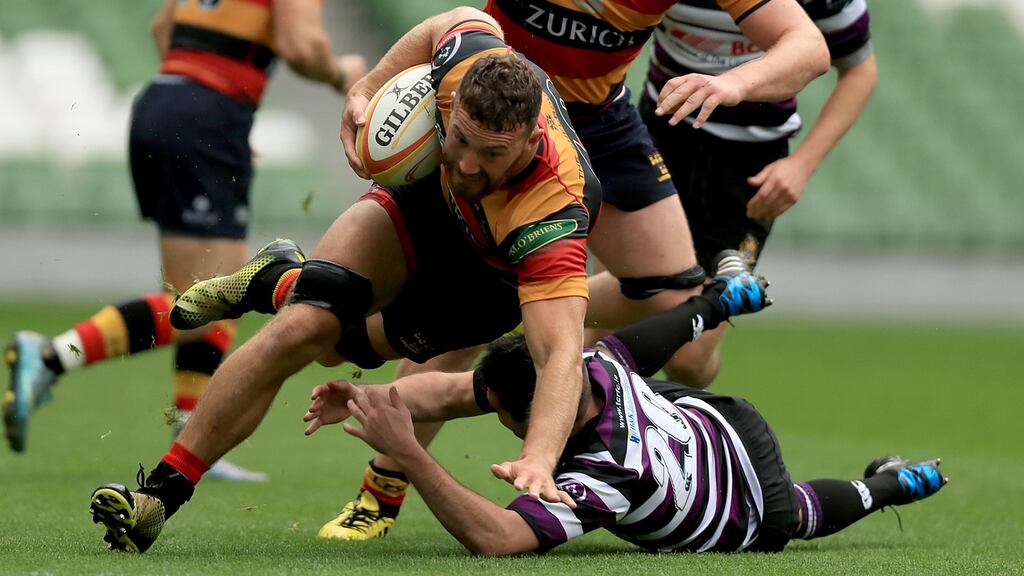 Lansdowne’s Jack O’Sullivan is tackled by Thomas Burke of Terenure duriing the Ulster Bank League Divison 1A game at the Aviva Stadium. Photograph: Donall Farmer/Inpho