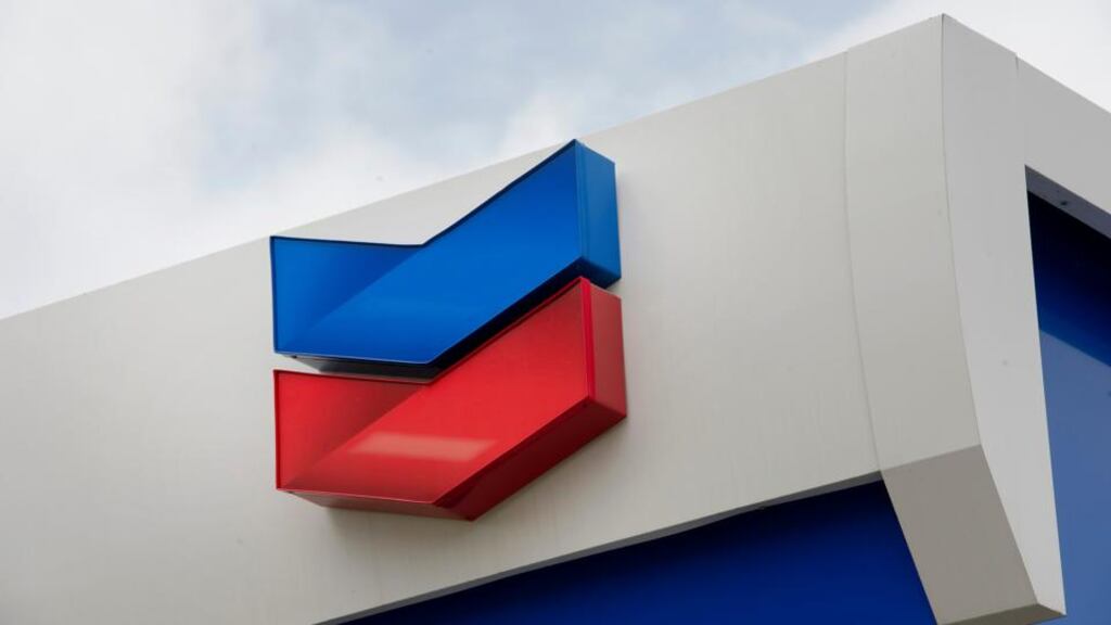 Chevron found that crude prices dropped and bad weather disrupted some oil and natural gas production. Photographer: David Paul Morris/Bloomberg