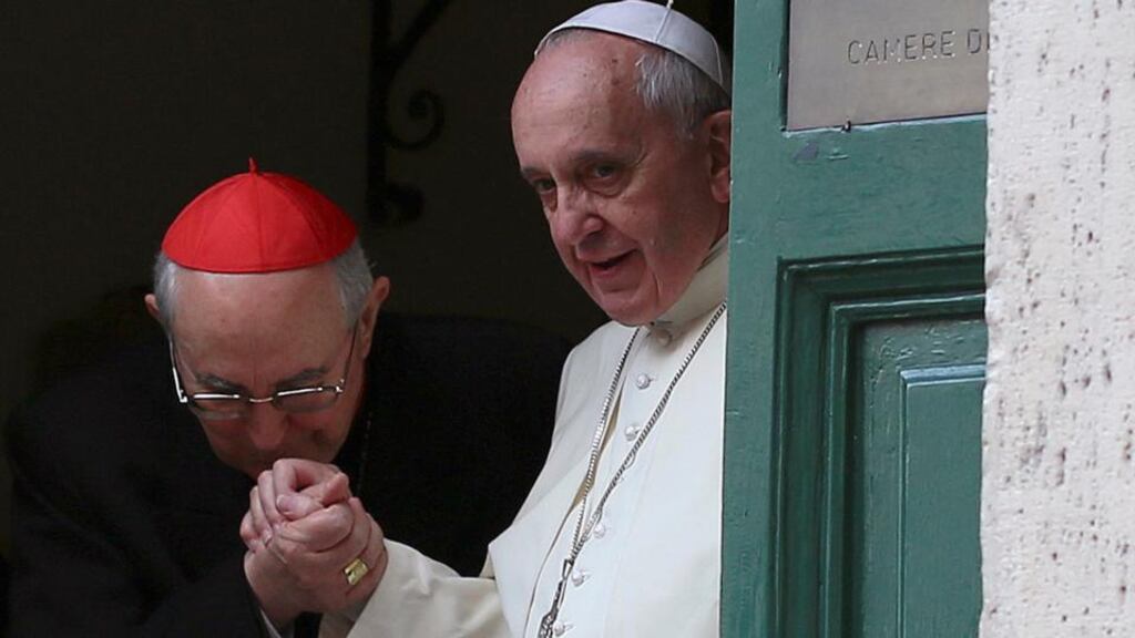 Cardinal Agostino Vallini kisses the hand of Pope Francis as he leaves mass at the Church of the Most Holy Name of Jesus in Rome yesterday. Photograph: Reuters/Alessandro Bianchi )