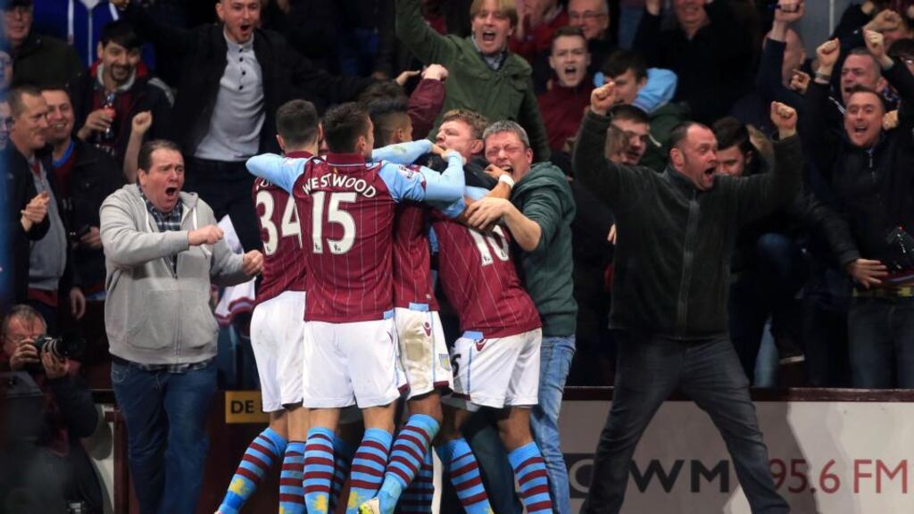 Fabian Delph mobbed by his team mates after giving Aston Villa the lead in their 2-0 FA Cup quarter final win over West Bromwich Albion. Photograph: PA
