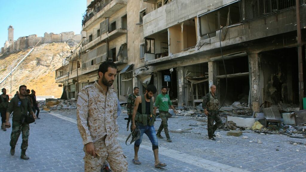 Syrian pro-government troops in the Farafira district, northwest of Aleppo’s historic citadel, after taking control of the  rebel-held district: The closure of the hospitals, known   as M-2 and M-10, will make the already desperate  medical situation nearly untenable for the almost 250,000 people trapped in the opposition-held areas. Photograph: Georges Ourfalian/AFP/Getty Images