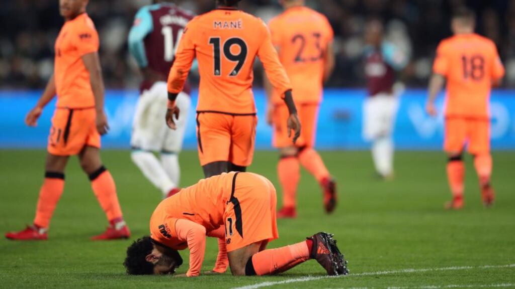 Liverpool’s Mohamed Salah celebrates scoring his side’s fourth goal at the London Stadium. Photograph: PA