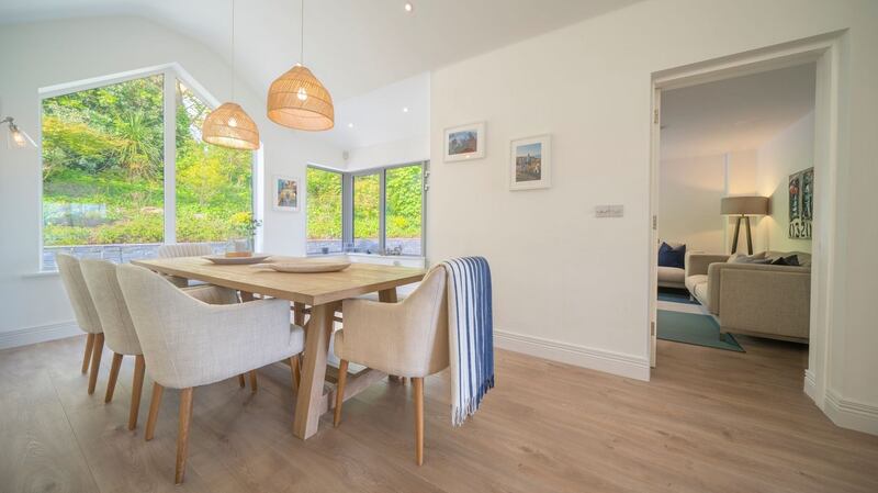 The dining room lies to the rear of the house