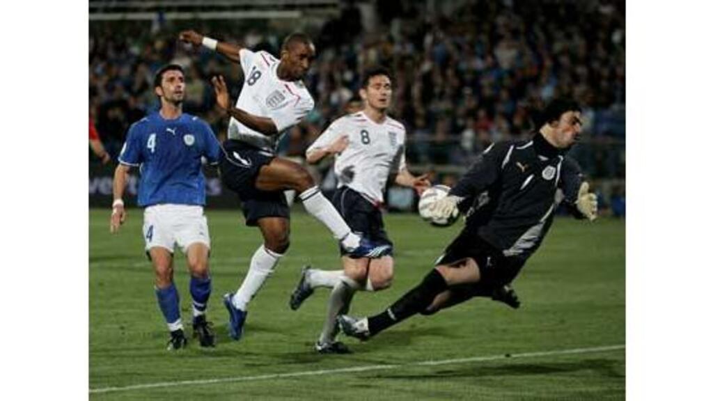 England forward Jermain Defoe has a shot saved by Israeli
goalkeeper Dudu Aouate at the Ramat Gan Stadium in Tel Aviv on
Saturday. The draw has increased the pressure on England manager
Steve McClaren.