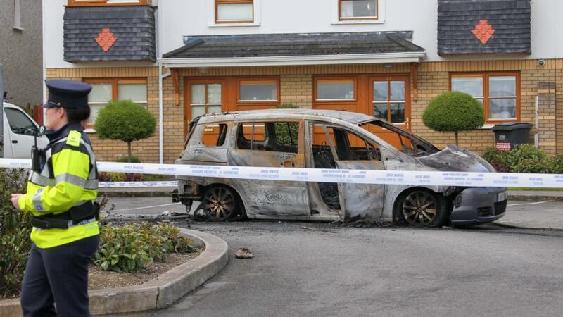 A burned out car on Belfry Square, near the scene of a shooting at a house on the Kiltalown Road, Tallaght. Photograph: Colin Keegan/Collins Dublin