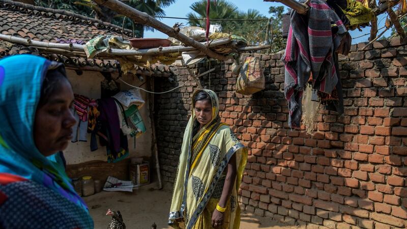 Sanju Devi, centre, a Christian whose husband was killed in December 2020, in the state of Bihar, India. Photograph: Atul Loke/New York Times
