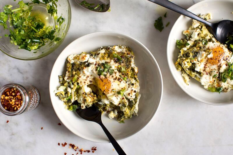 Yotam Ottolenghi’s herby polenta: with runny eggs embedded in it, as well as lots of greens and chunks of cheese, it is wonderful in a very different way from my father’s dish. Photograph: Andrew Scrivani/New York Times
