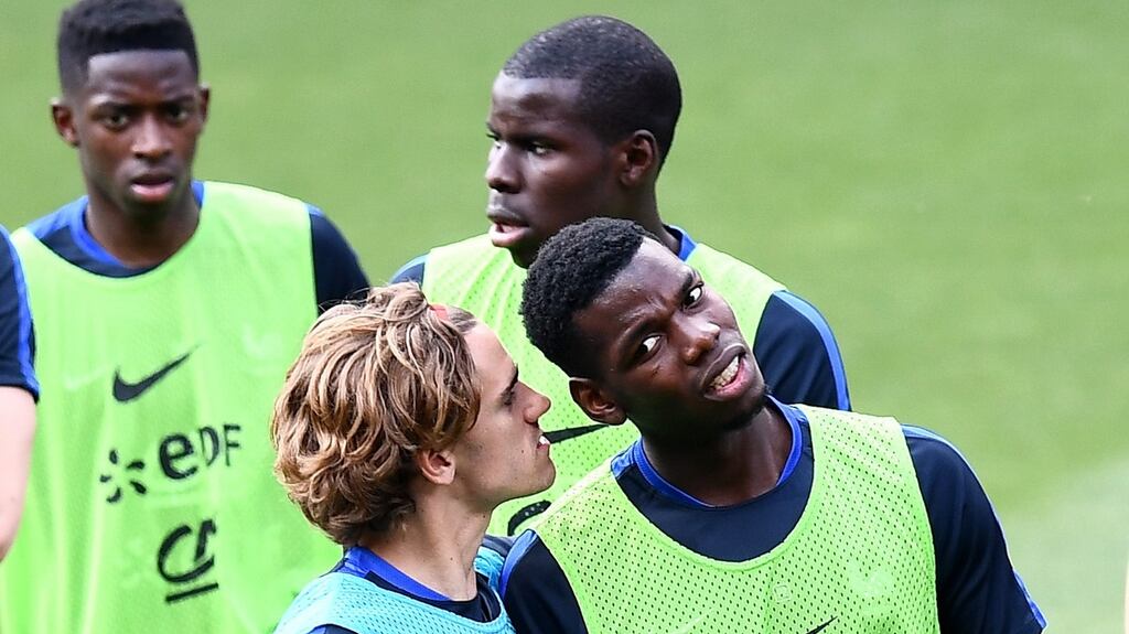 Antoine Griezmann jokes with his France team mate Paul Pogba during a training session for the national team. Photograph: Getty Images