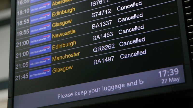 An electronic board shows British Airways flights cancelled at Heathrow Airport Terminal 5. Photograph: AFP