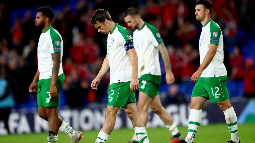 Ireland’s Cyrus Christie, Seamus Coleman, Shane Duffy and Enda Stevens leave the pitch dejected after their 4-1 loss to Wales. Photo: James Crombie/Inpho