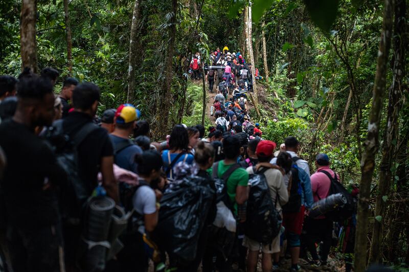 Migrants in the Darién Gap, the narrow stretch of jungle terrain connecting Colombia and Panama, near Acandi, Colombia. The surge of migrants trekking north, mostly from South America, has placed increasing pressure on Mexico. Photograph: Federico Rios/the New York Times
