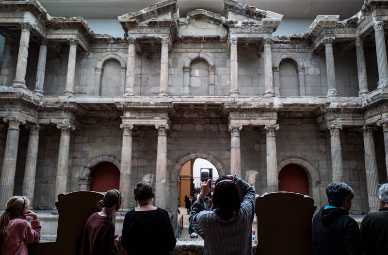 Visitors look at the ancient Roman Market Gate of Miletus in Berlin's Pergamon Museum. Photograph: John MacDougall/AFP/Getty