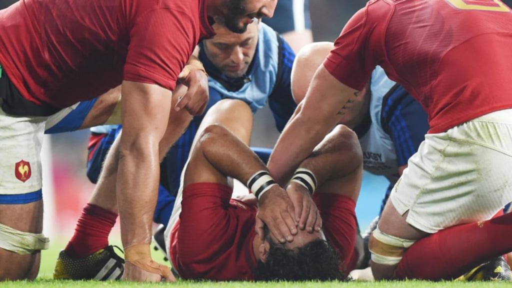 France’s Yoann Huget is comforted by team-mates after sustaining a cruciate injury to his right knee during the Rugby World Cup Pool D match against Italy at Twickenham. Photograph: Facundo Arrizabalaga/EPA