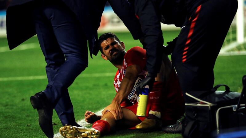 Diego Costa receives attention for a leg injury during the Copa del Rey last 16 match at Camp d’Esports stadium in Lleida. Photograph: Alejandro Garcia/EPA