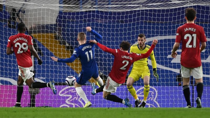 Manchester United’s Victor Lindelof makes a tackle to deny Chelsea’s Timo Werner. Photograph: Andy Rain/PA