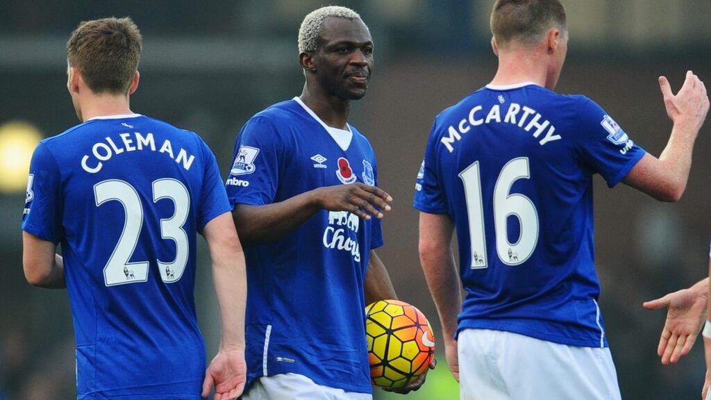 Hat trick scorer Arouna Kone of Everton holds the match ball as he celebrates with Seamus Coleman and James McCarthy. Photograph: David Ramos/Getty Images