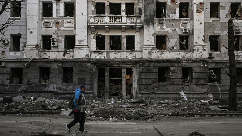 A man walks in front of a police station destroyed by shelling in Kharkiv on March 25th. Photograph: Aris Messinis/AFP via Getty