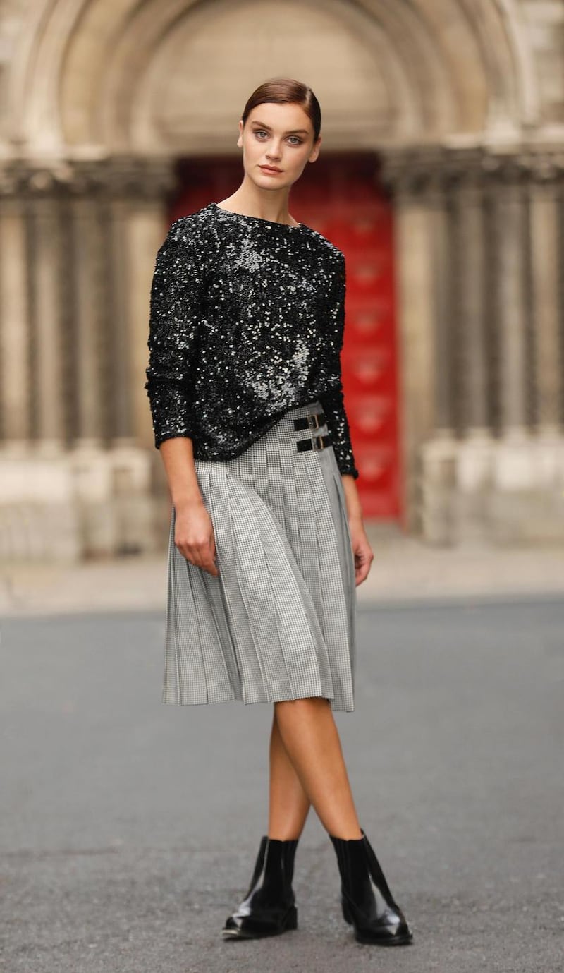 Per Una sparkly round neck long sleeve top, €54; Checked pleated midi skirt, €70