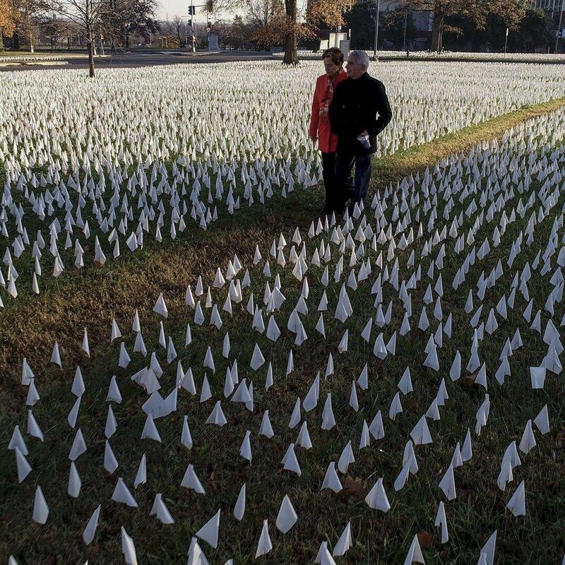 Dr Anthony Fauci and his wife, Christine Grady, walk through the Covid-19 installation In America, How Could This Happen in Washington DC. Photograph: Visko Hatfield/National Geographic for Disney+