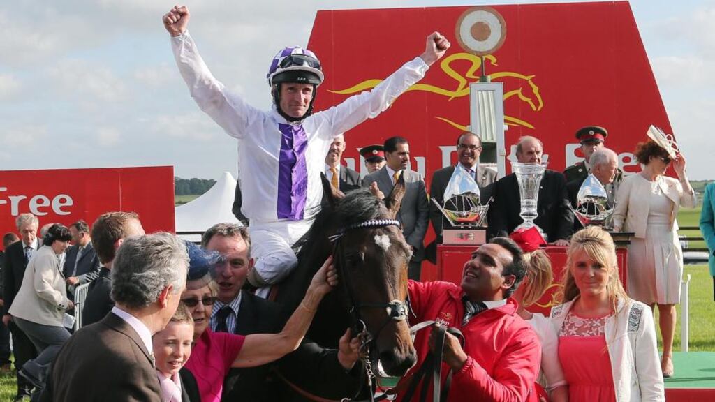 Kevin Manning on Trading Leather celebrates winning the Irish Derby at the Curragh. Photograph: Lorraine O’Sullivan/Inpho