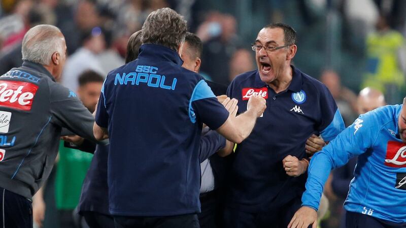 Napoli coach Maurizio Sarri celebrates after the match with his coaching staff. Photo: Stefano Rellandini/Reuters