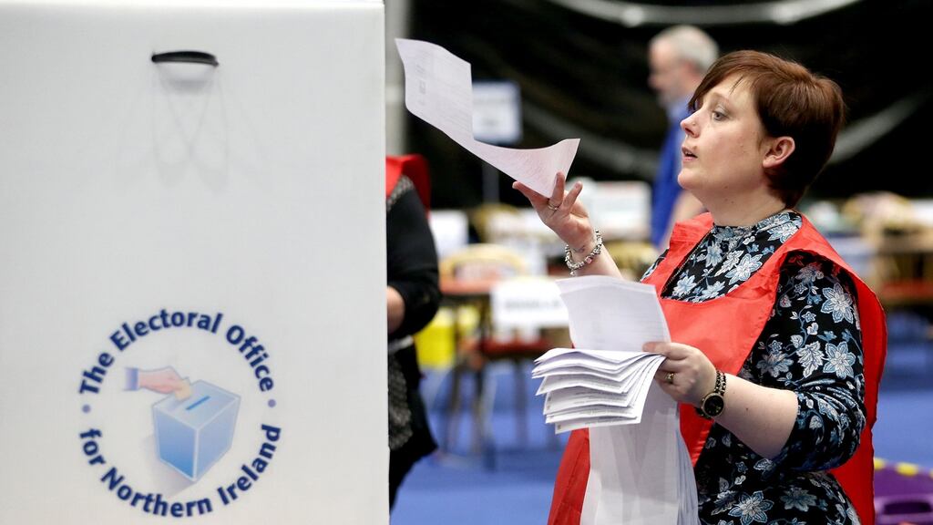 A count supervisor sorts voting papers at the Titanic Exhibition Centre, Belfast. ‘A lot of us were fairly bemused at the Sinn Féin reaction to the Electoral Office’s legal duty to refresh the register,’ said SDLP leader Colum Eastwood.